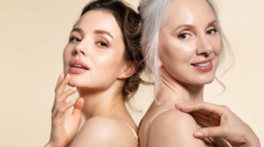 Two beautiful different age woman with perfect skin headshot portrait. Senior lady and young girl in underwear standing back-to-back posing for camera. Spa beauty salon procedure and home skincare